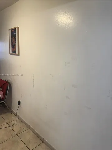 a view of a livingroom with furniture and a window