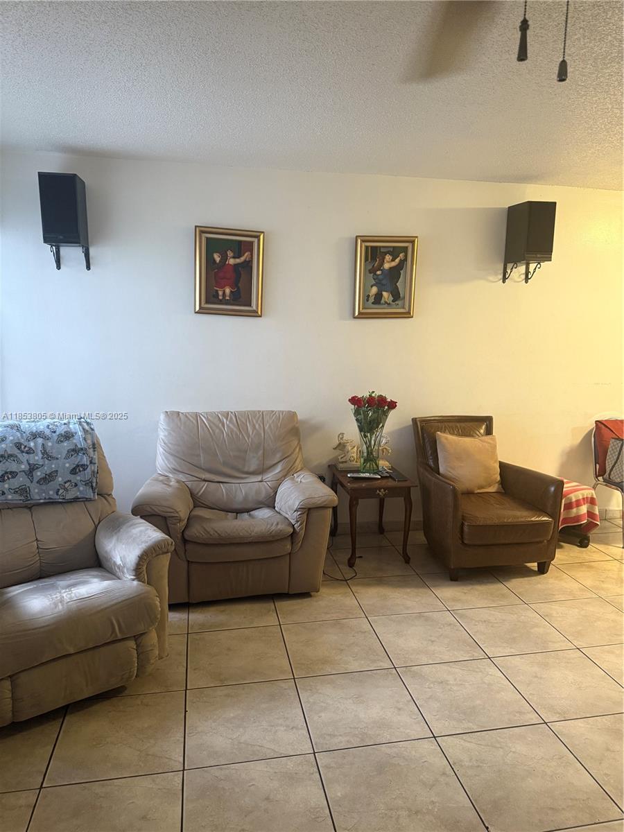 11472 Southwest 4th Street Sweetwater, FL 33174 - Photo 21 of 65 a living room with furniture and a couch