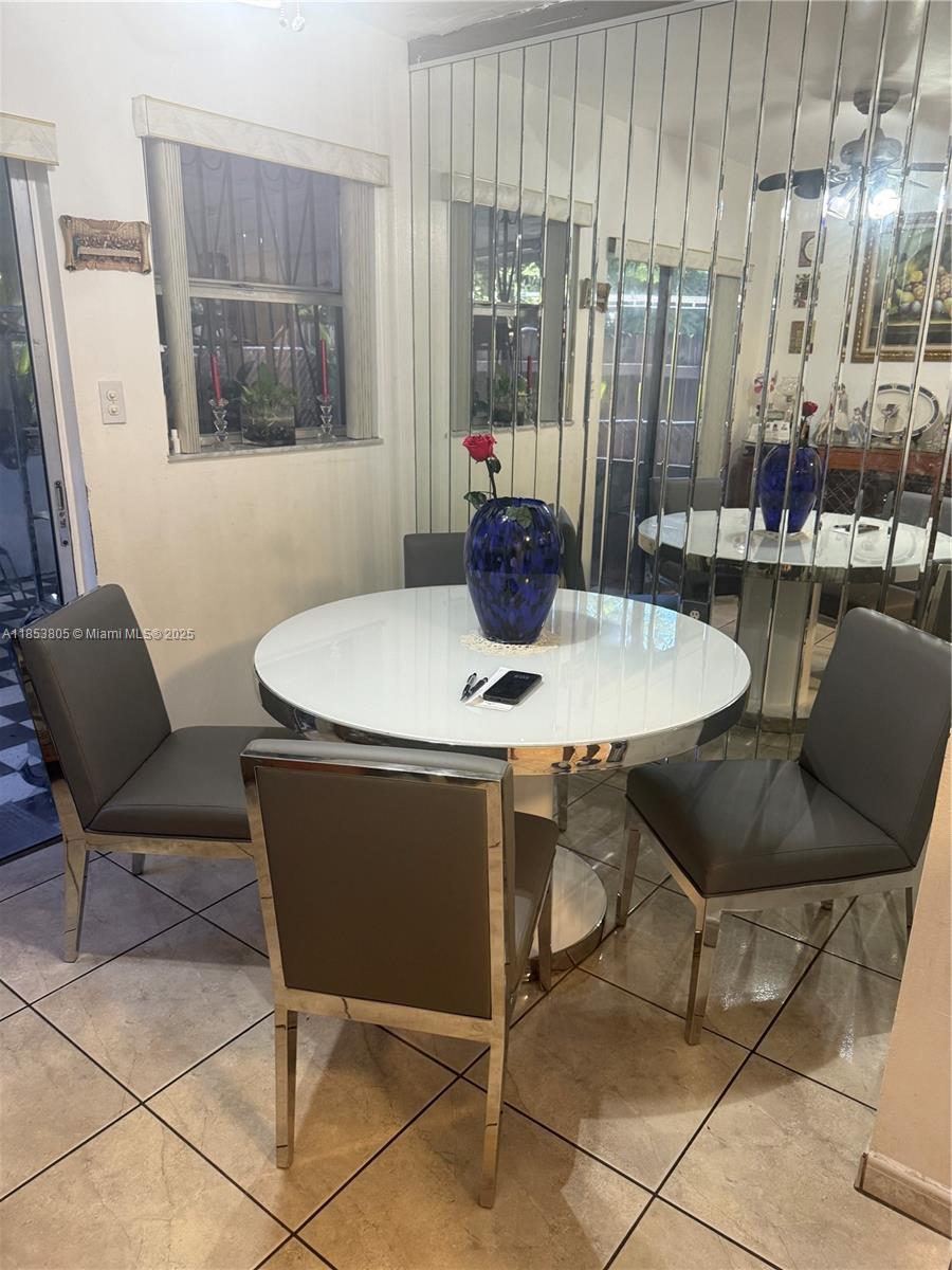 11472 Southwest 4th Street Sweetwater, FL 33174 - Photo 24 of 65 a dining room with furniture and window