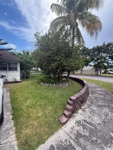 a bed sitting in a room next to a window