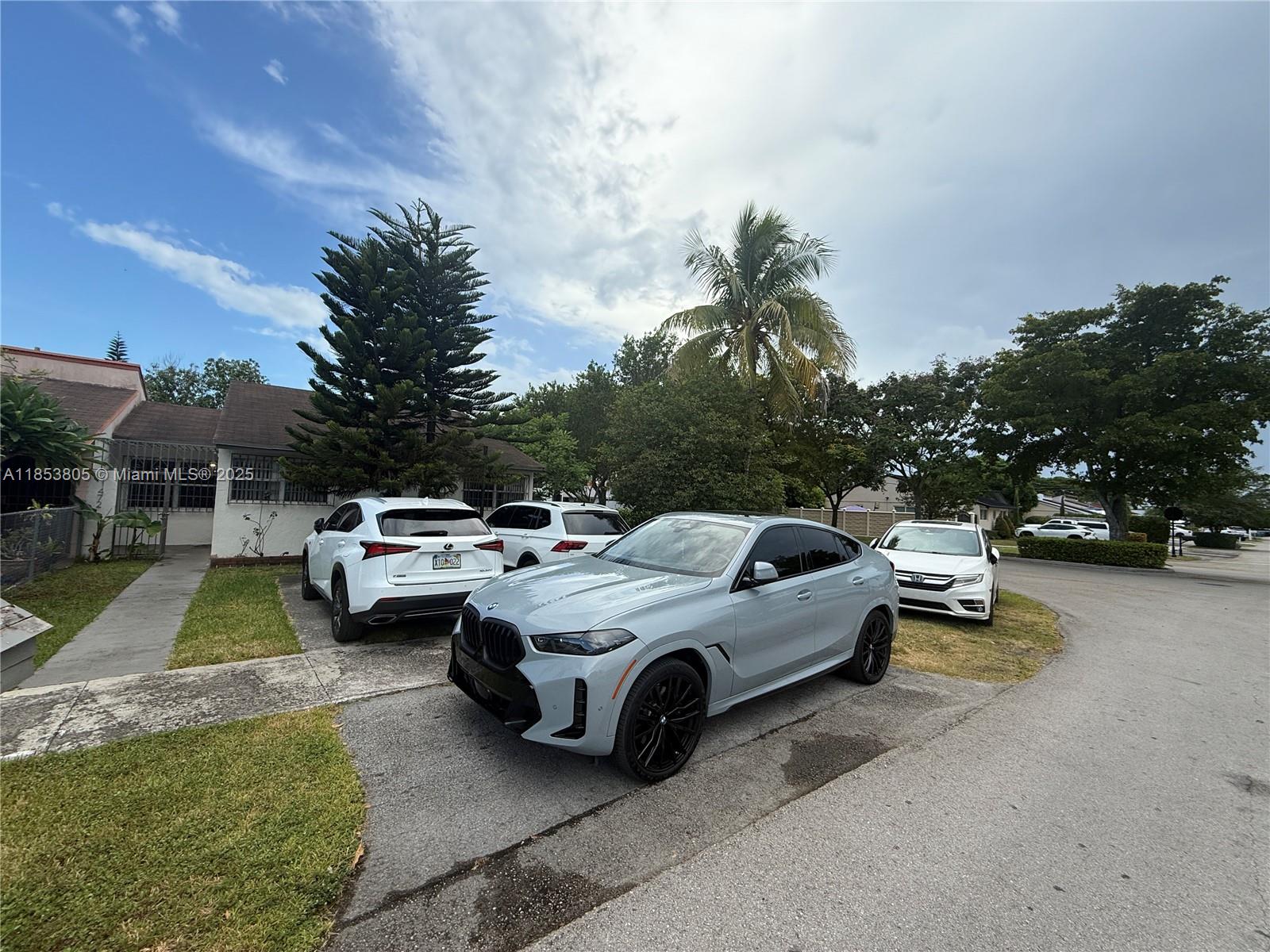 11472 Southwest 4th Street Sweetwater, FL 33174 - Photo 36 of 65 a view of the patio with couches and a fire pit