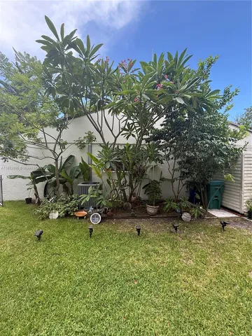 a view of work space with furniture and window