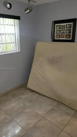 a bathroom with a toilet a sink and a mirror