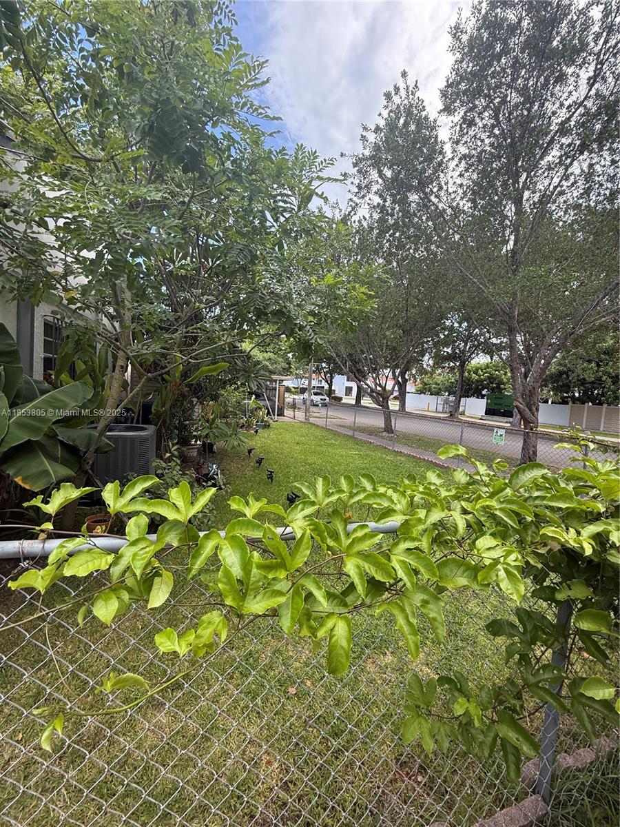 11472 Southwest 4th Street Sweetwater, FL 33174 - Photo 7 of 65 a view of a yard with table and chairs