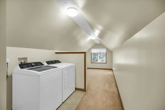 an empty room with windows and ceiling fan