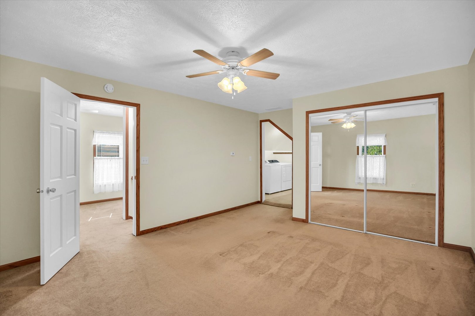221 East 5th Avenue Rankin, IL 60960 - Photo 19 of 44 an empty room with closet and a chandelier fan