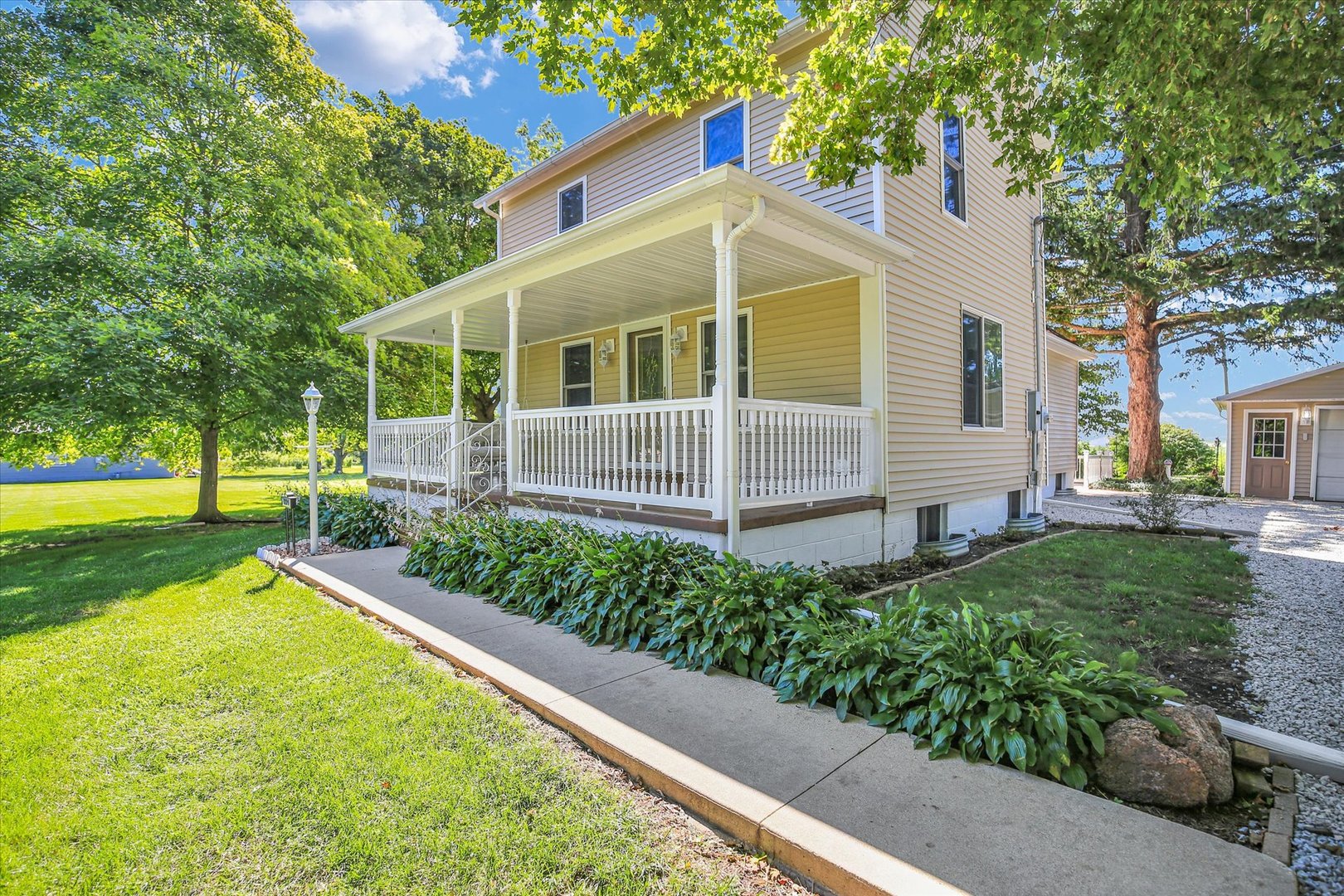 221 East 5th Avenue Rankin, IL 60960 - Photo 2 of 44 a view of a house with backyard and a tree