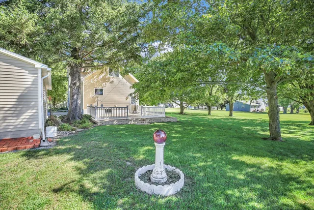 an aerial view of residential house with an outdoor space and seating