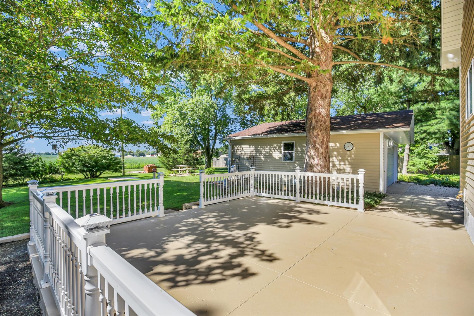 221 East 5th Avenue Rankin, IL 60960 - Photo 34 of 44 a view of a deck with a large window and wooden fence