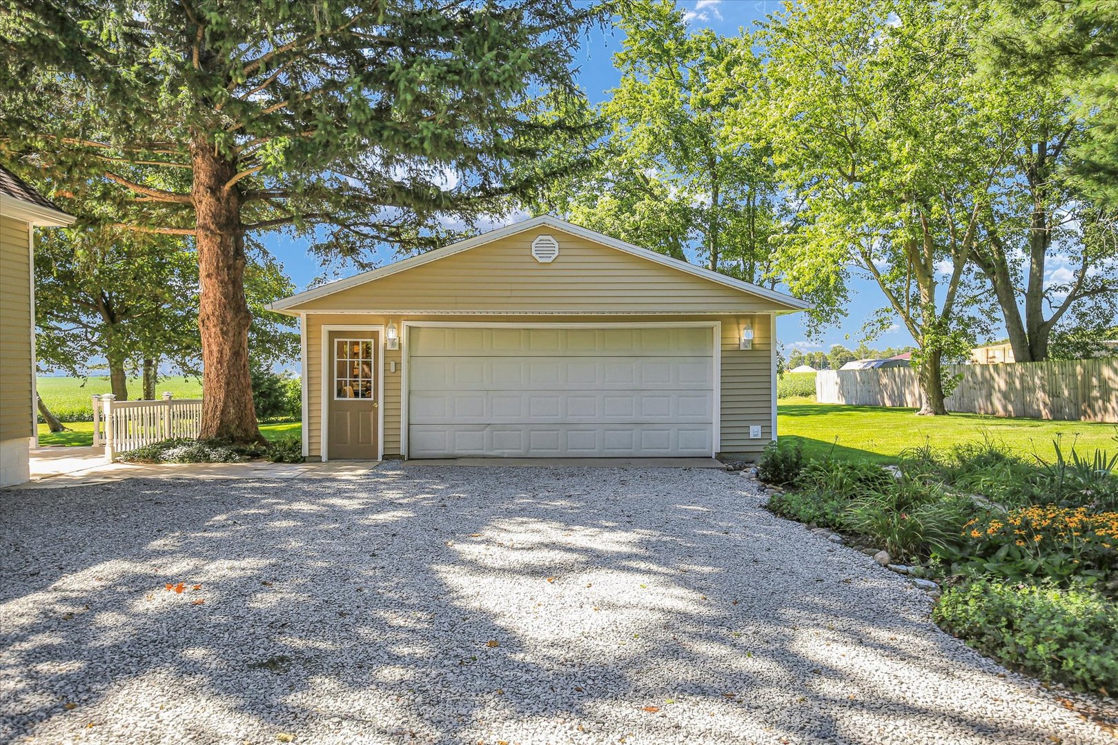 221 East 5th Avenue Rankin, IL 60960 - Photo 37 of 44 a front view of a house with a yard and garage