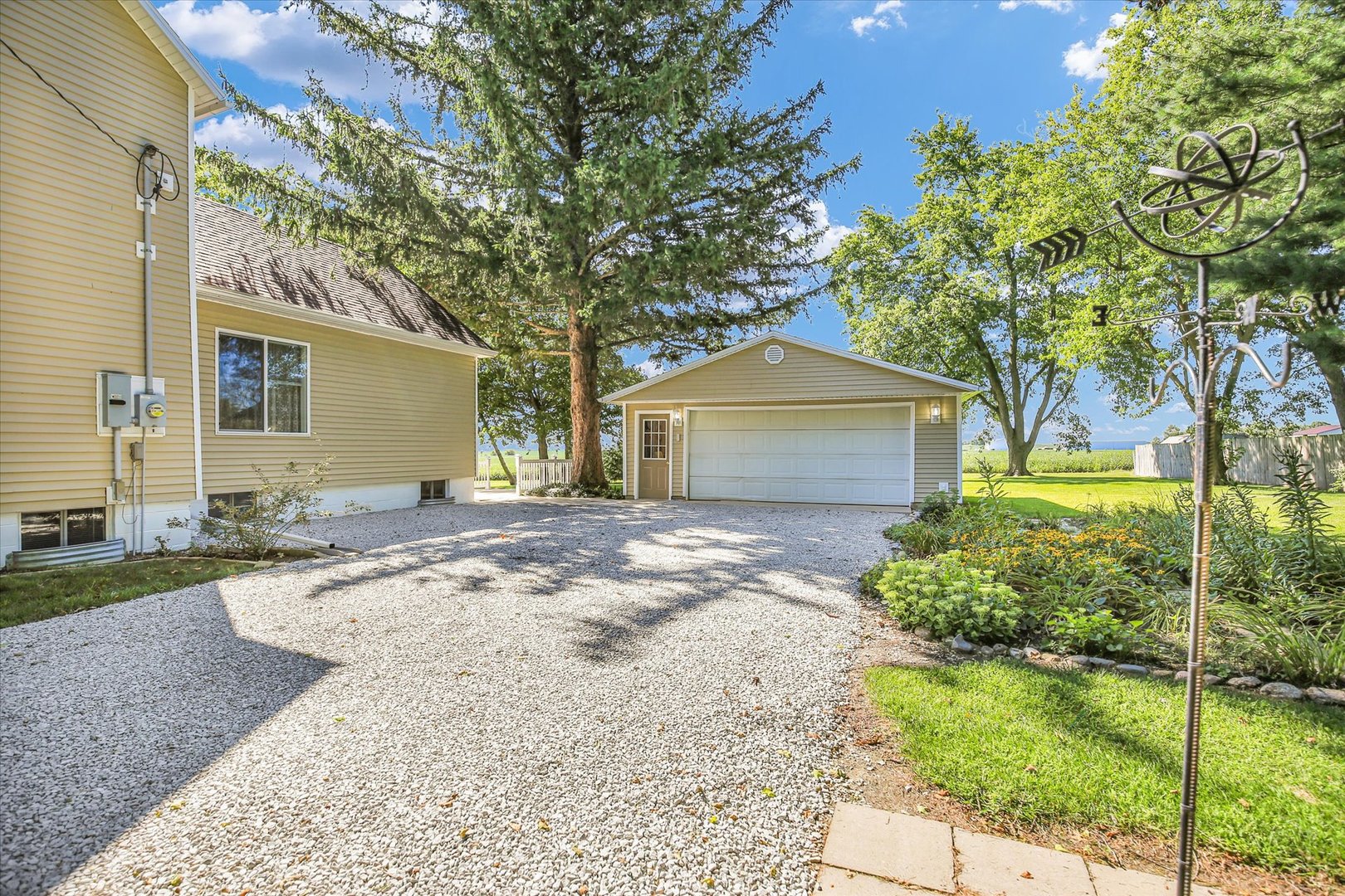 221 East 5th Avenue Rankin, IL 60960 - Photo 38 of 44 a front view of a house with a yard and garage