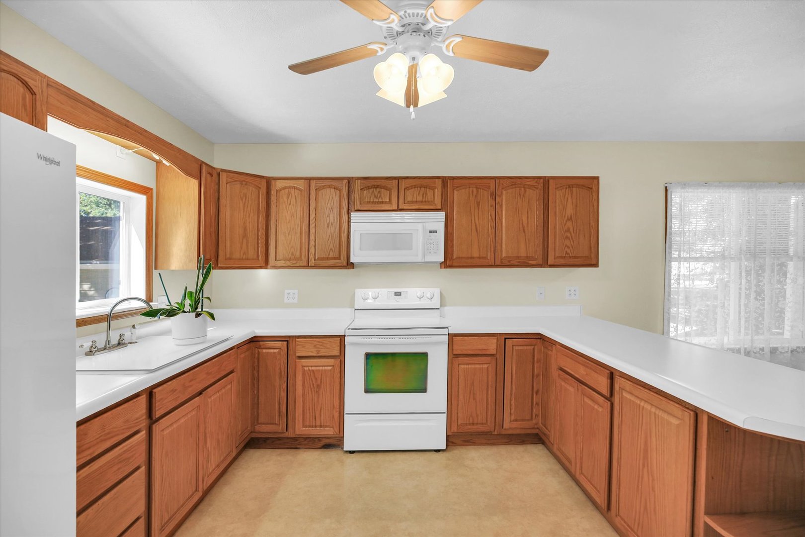 221 East 5th Avenue Rankin, IL 60960 - Photo 8 of 44 a kitchen with stainless steel appliances granite countertop a sink dishwasher stove and refrigerator