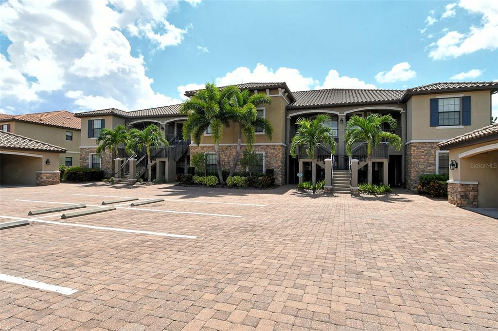 13604 Messina Loop, Unit 203 Bradenton, FL 34211 - Photo 1 of 56 a view of a house with backyard porch and sitting area
