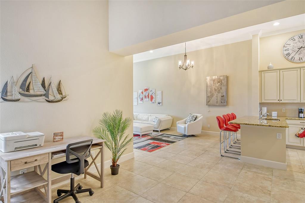 13604 Messina Loop, Unit 203 Bradenton, FL 34211 - Photo 20 of 56 a living room with furniture and a flat screen tv