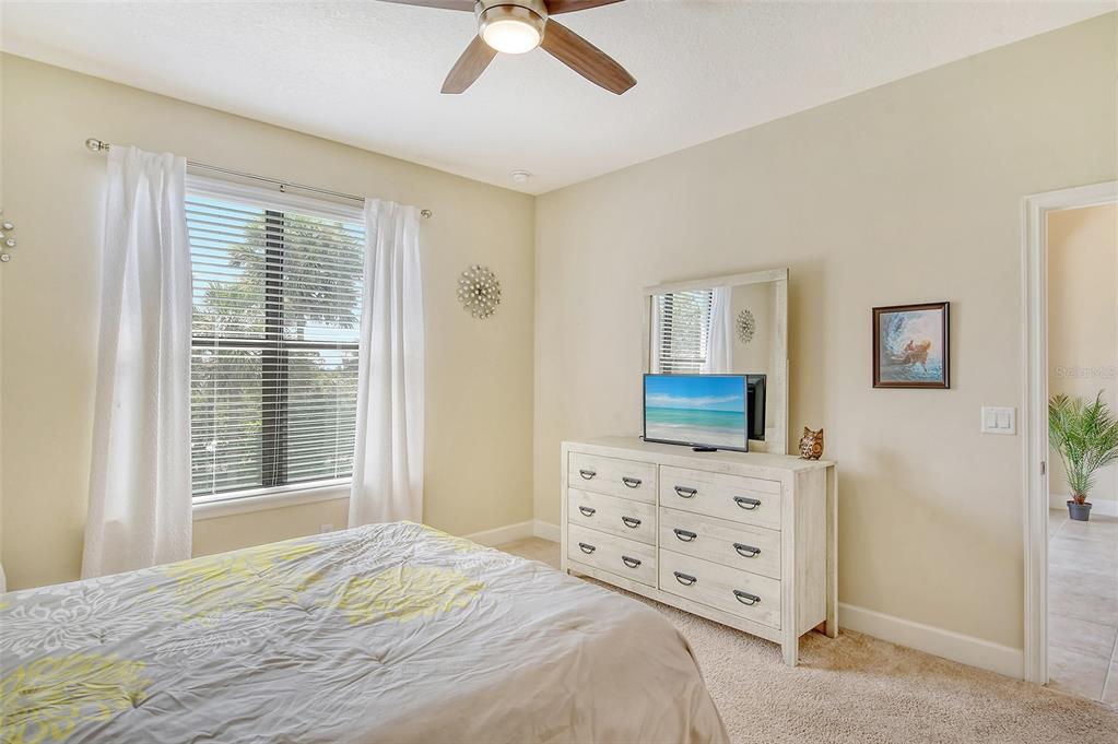 13604 Messina Loop, Unit 203 Bradenton, FL 34211 - Photo 22 of 56 a bedroom with a bed and a dresser