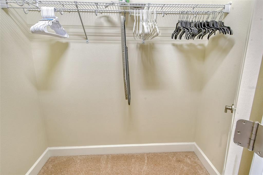 13604 Messina Loop, Unit 203 Bradenton, FL 34211 - Photo 25 of 56 a view of a room with racks on the wall