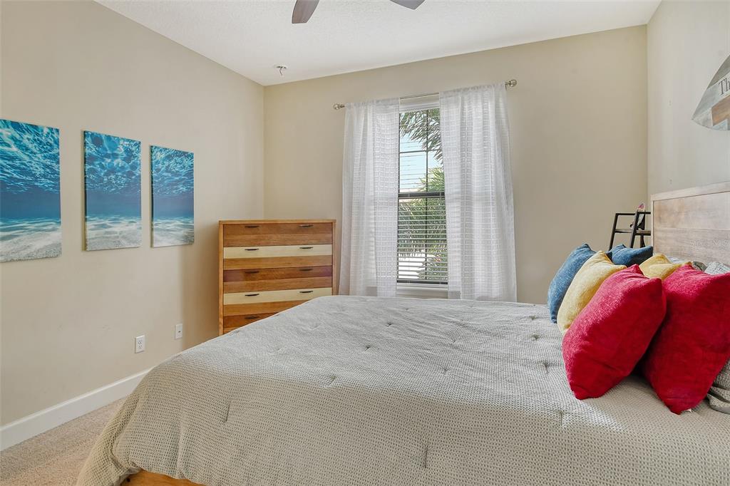 13604 Messina Loop, Unit 203 Bradenton, FL 34211 - Photo 27 of 56 a bedroom with a bed and a window