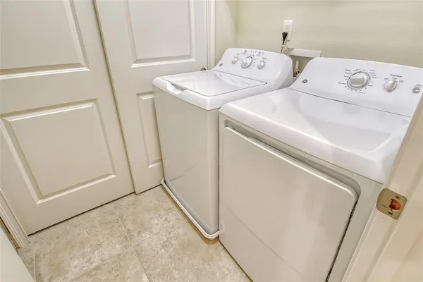 a view of an chairs and table in the patio