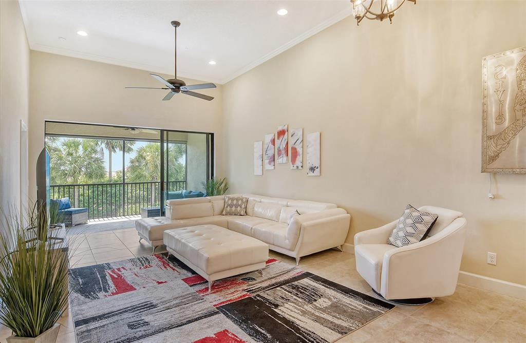 13604 Messina Loop, Unit 203 Bradenton, FL 34211 - Photo 4 of 56 a living room with furniture and a large window