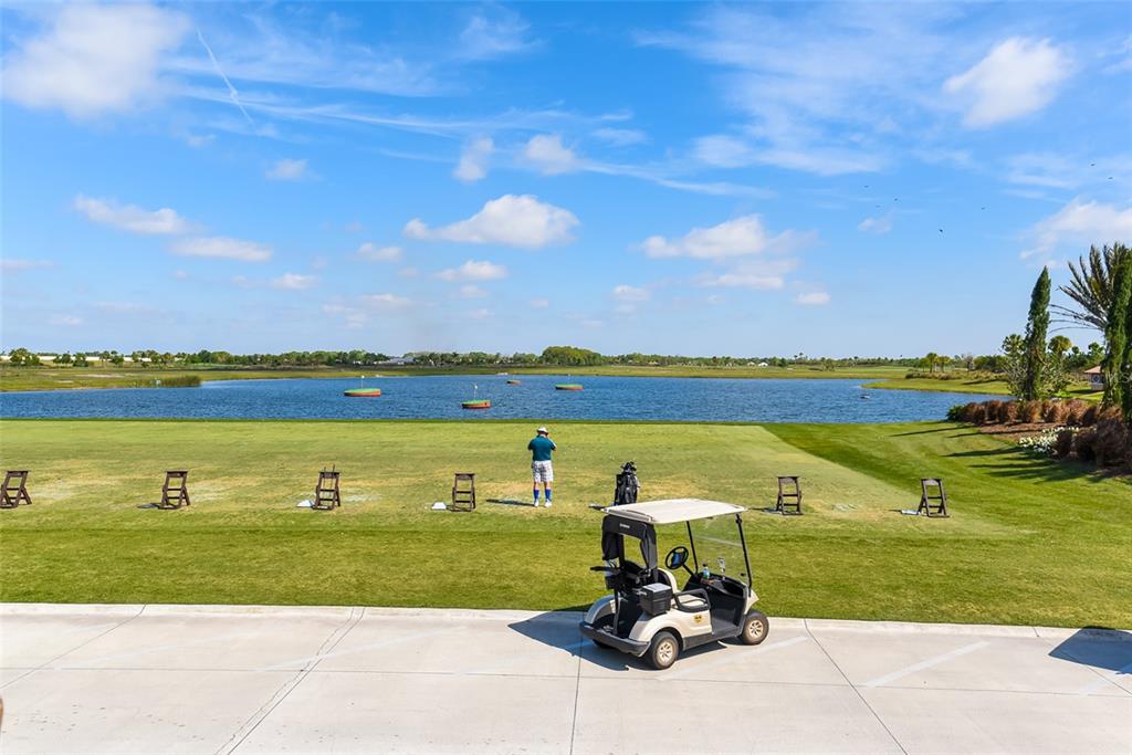 13604 Messina Loop, Unit 203 Bradenton, FL 34211 - Photo 41 of 56 a view of a lake with a yard