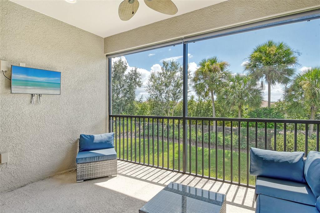 13604 Messina Loop, Unit 203 Bradenton, FL 34211 - Photo 7 of 56 a view of a chair and table in the balcony