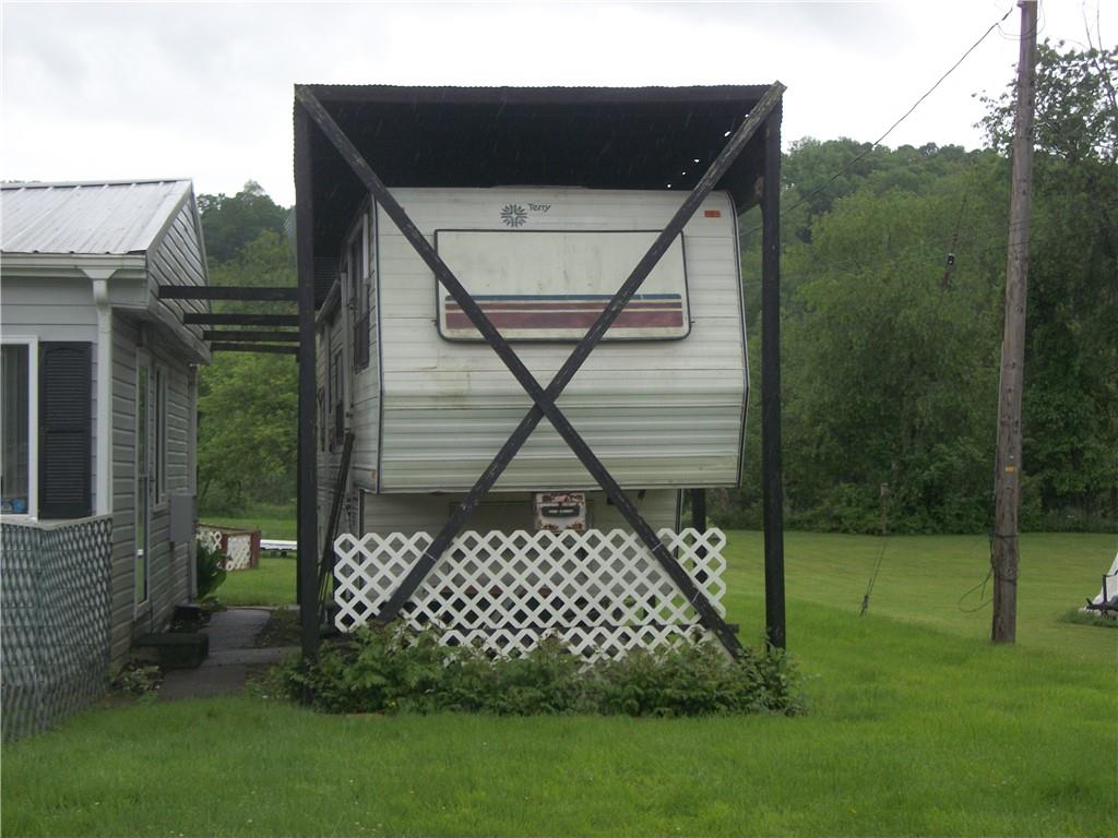944 Mapletown Road Greensboro, PA 15338 - Photo 19 of 20 a side of a house with a yard