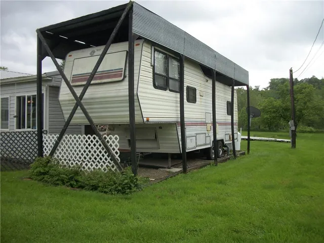 a backyard of a house with lots of green space