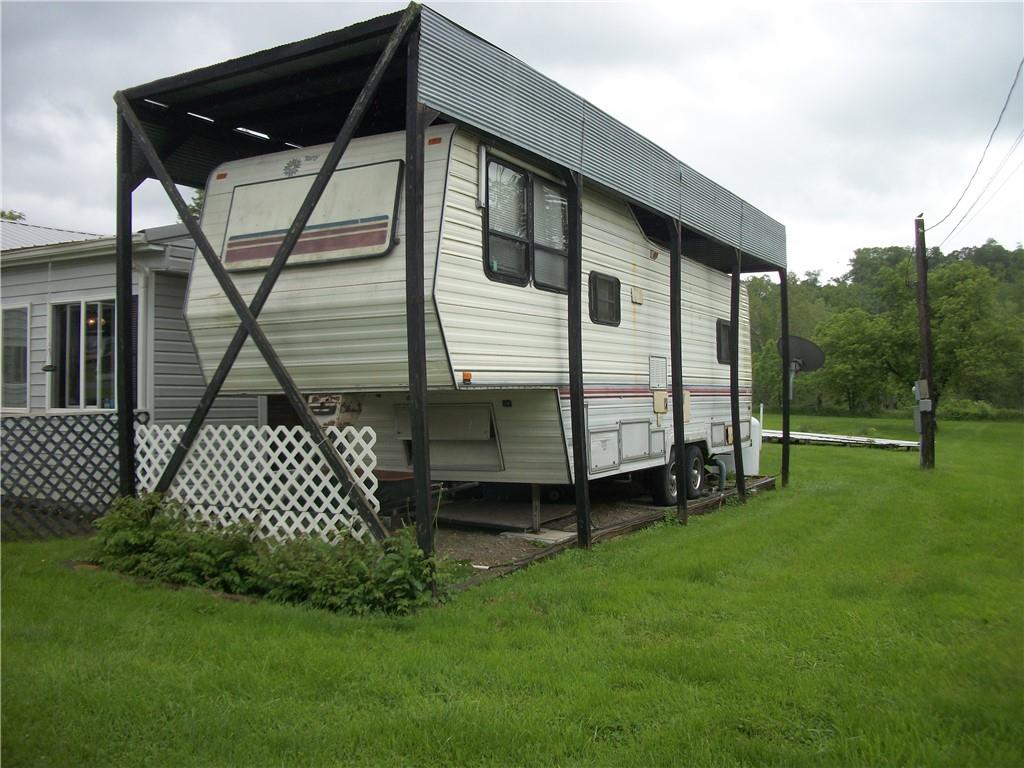 944 Mapletown Road Greensboro, PA 15338 - Photo 20 of 20 a backyard of a house with lots of green space