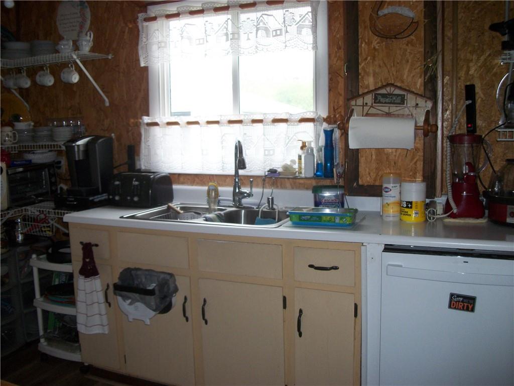 944 Mapletown Road Greensboro, PA 15338 - Photo 3 of 20 a kitchen with a sink cabinets and a window