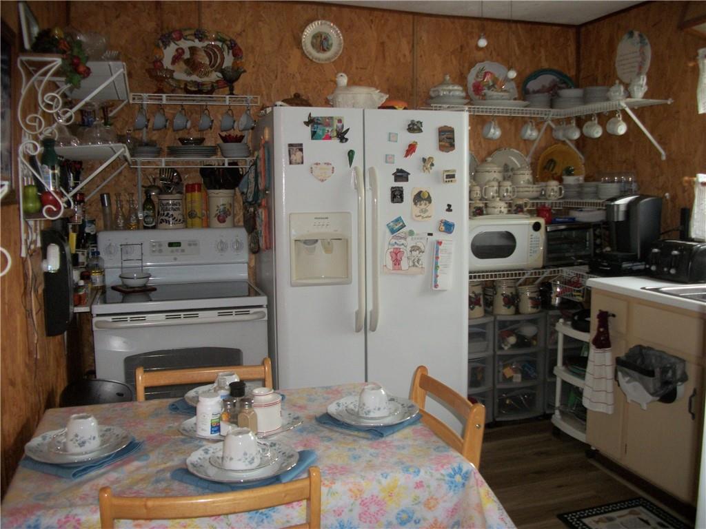 944 Mapletown Road Greensboro, PA 15338 - Photo 4 of 20 a kitchen with a stove and a fireplace