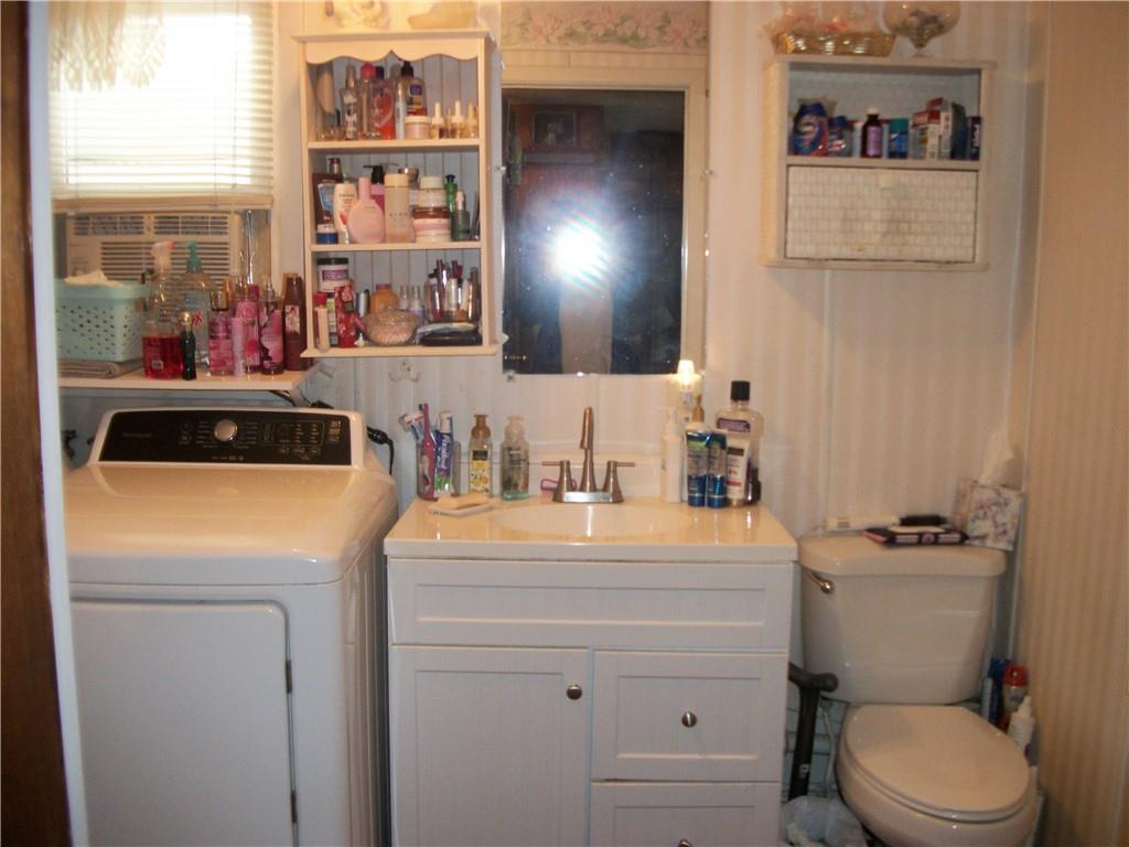 944 Mapletown Road Greensboro, PA 15338 - Photo 6 of 20 a bathroom with a toilet sink and mirror