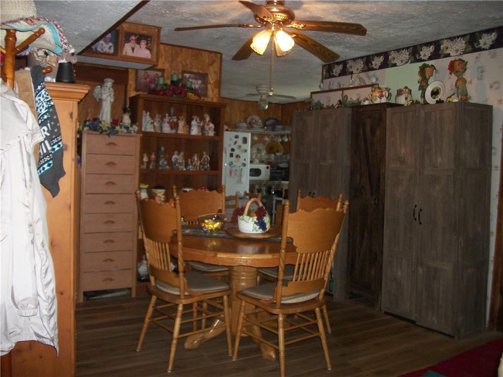 944 Mapletown Road Greensboro, PA 15338 - Photo 9 of 20 a dining room with furniture and wooden floor