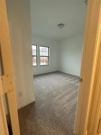 a bathroom with a double vanity sink toilet mirror and bathtub