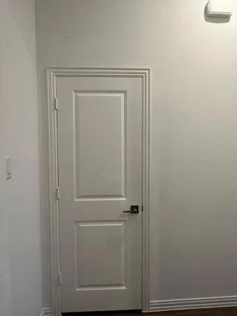 a white toilet sitting next to a shower
