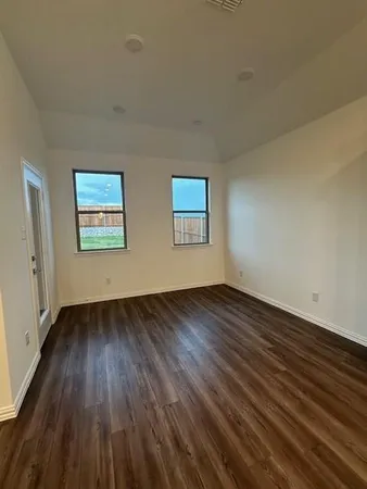 a view of hallway with wooden floor