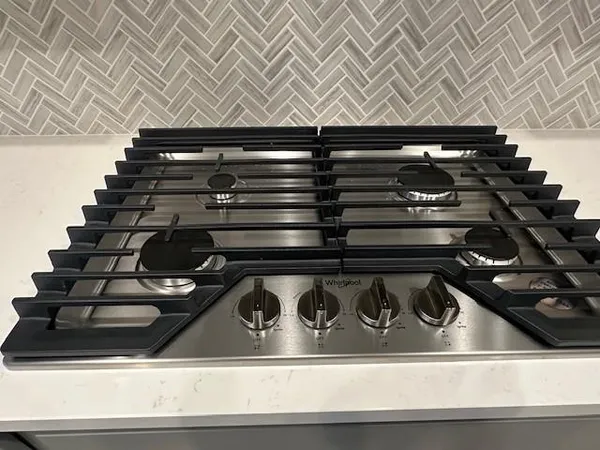 a kitchen with a cabinets and white appliances