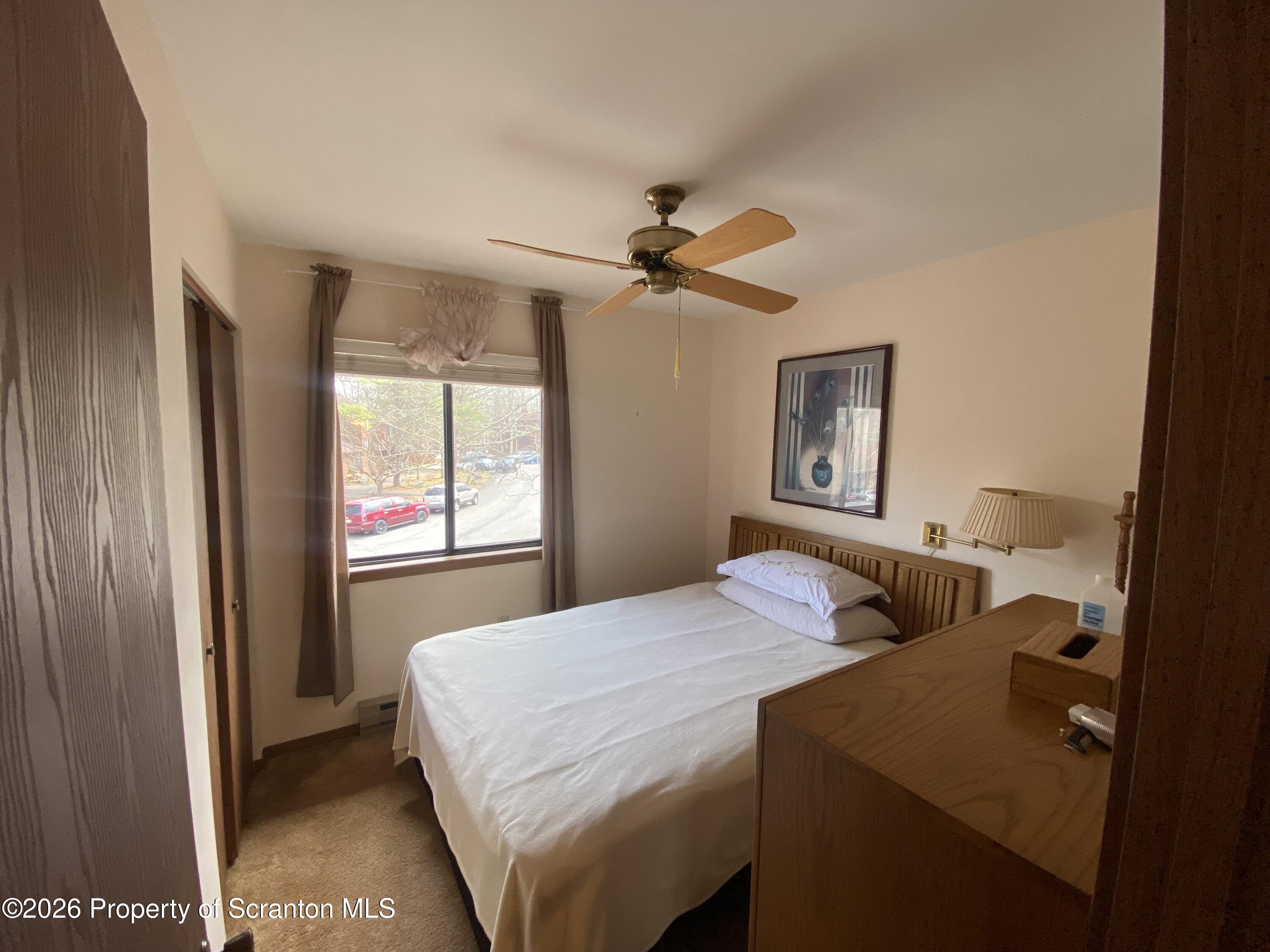 211 Falls Circle Bushkill, PA 18324 - Photo 17 of 28 a bedroom with a bed and a window
