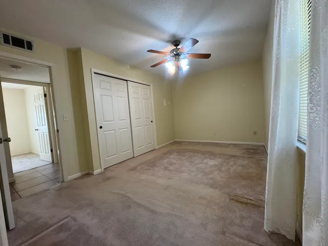 a bathroom with a toilet a sink and a shower