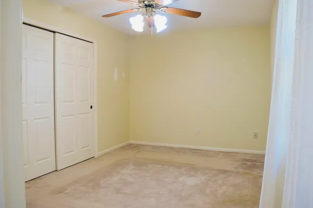 a bathroom with a toilet sink and shower