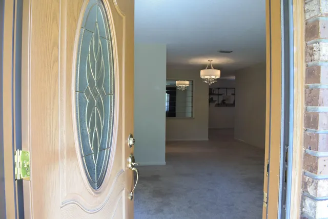 a view of a bathroom from a hallway