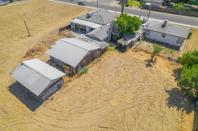 an aerial view of a house with outdoor space