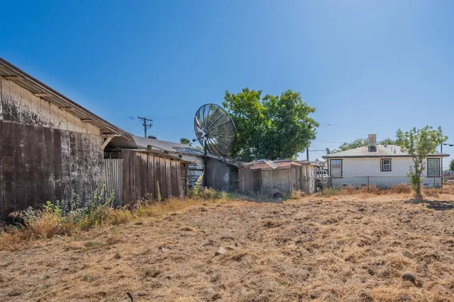 an aerial view of residential house with parking