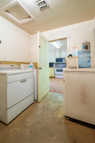 a view of a bedroom with window and ceiling fan