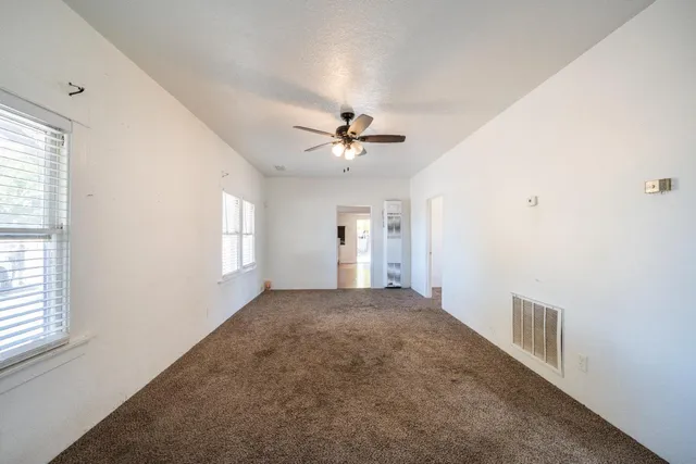 a view of an empty room and window
