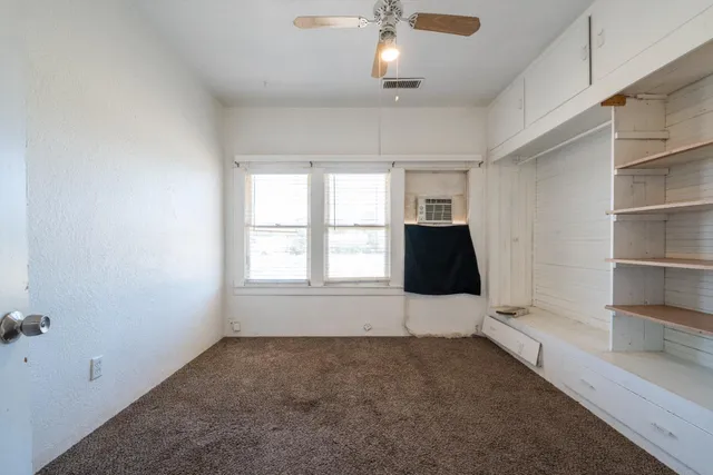 a kitchen with a sink and refrigerator