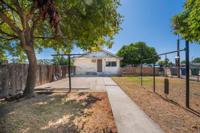 a view of a house with a street