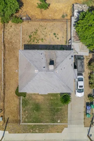 a view of a room with a window and a ceiling fan