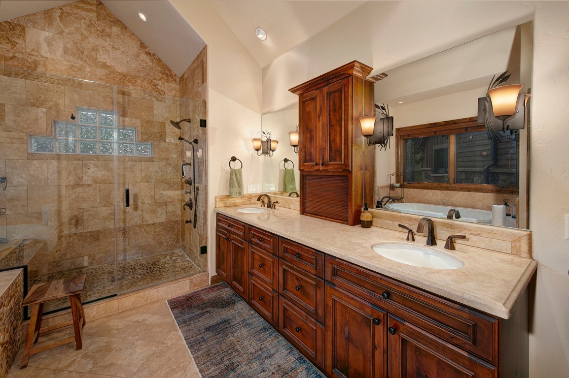 724 Willowbrook Road Silverthorne, CO 80498 - Photo 19 of 30 a bathroom with double vanity and a shower
