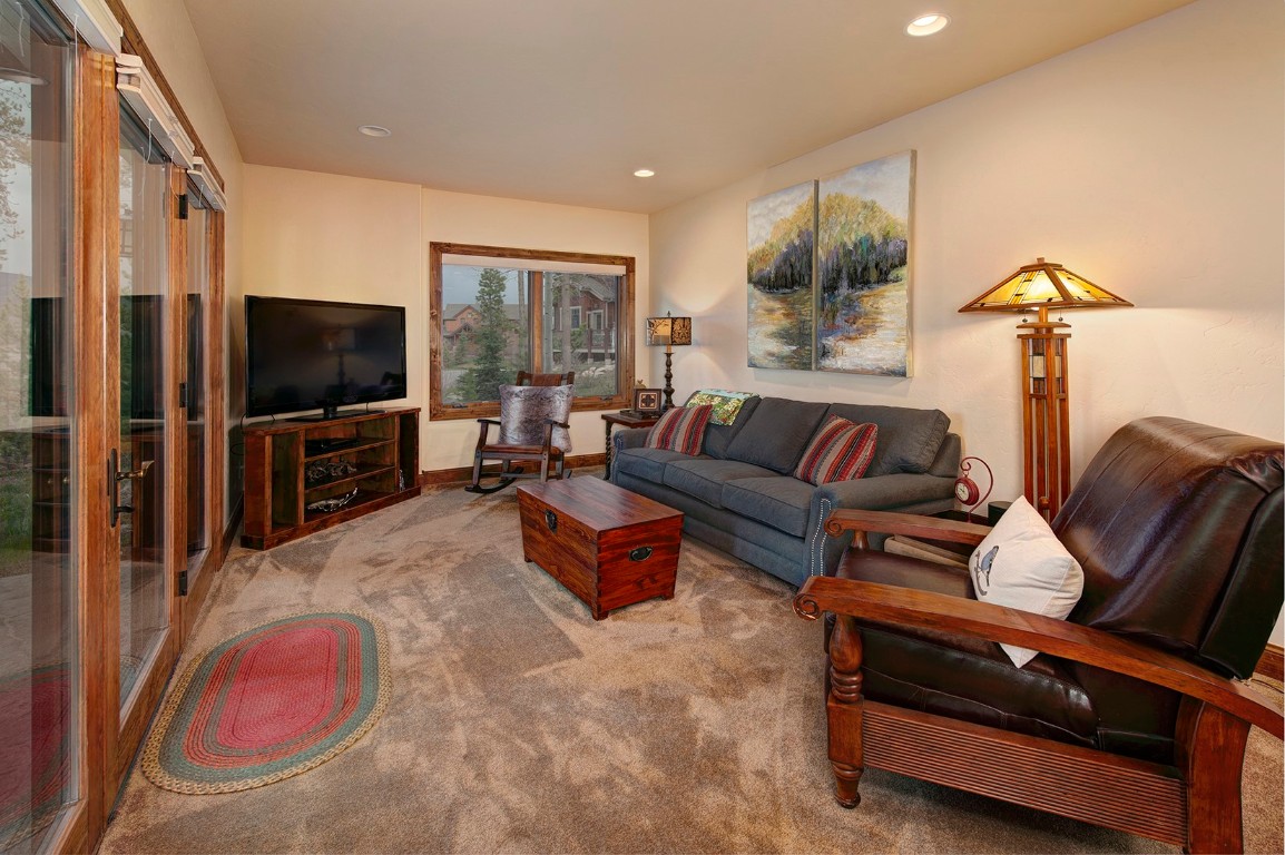 724 Willowbrook Road Silverthorne, CO 80498 - Photo 21 of 30 a living room with furniture and a flat screen tv