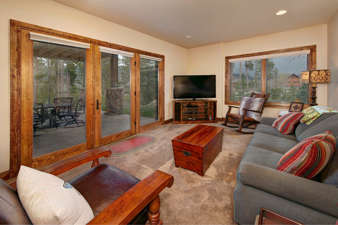 724 Willowbrook Road Silverthorne, CO 80498 - Photo 22 of 30 a living room with furniture and a flat screen tv